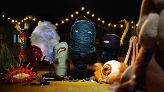 Monster friends on stage embracing their individuality