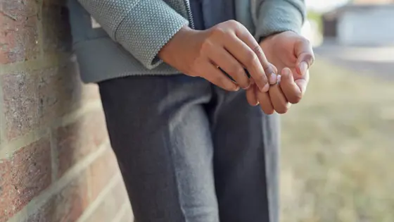 A close-up photograph of a child's hands.