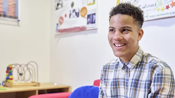 A young person smiling