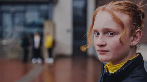 A  teenage girl looking thoughtful
