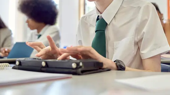 Photo of a young person in school uniform.