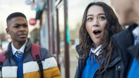 Two people looking shocked and amused at another person.