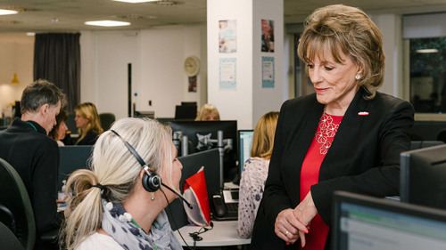 Dame Esther Rantzen talking to one of the Childline counsellors