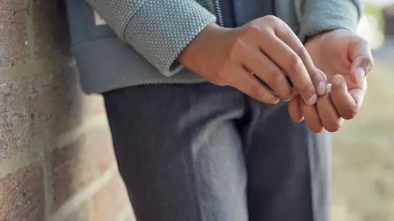 Close up photo of a young person's hands.