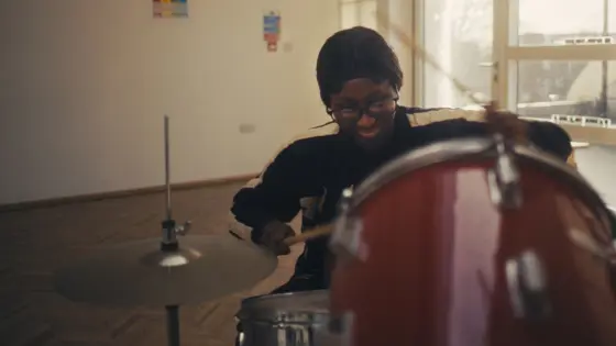 Girl playing drums