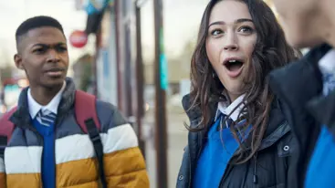 Two people looking shocked and amused at another person.